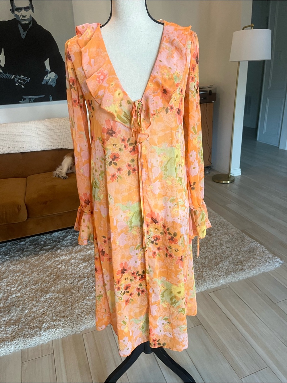 Orange floral maxi dress with ruffle sleeves and tie front